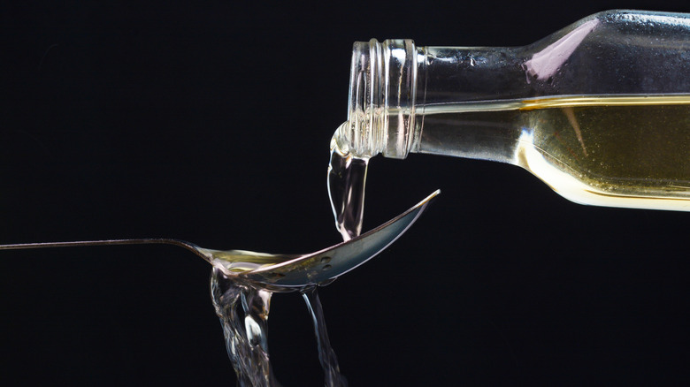 Vinegar poured onto a spoon