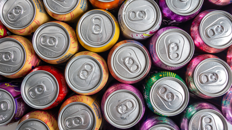 A top-down view of several different soda cans