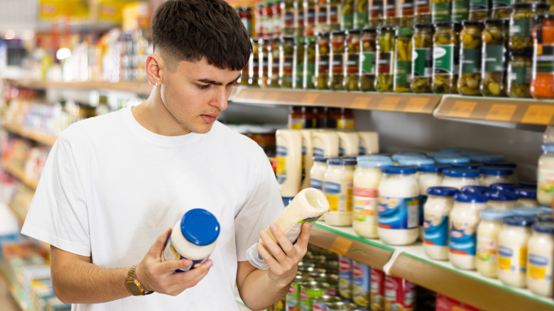 man shopping for mayo