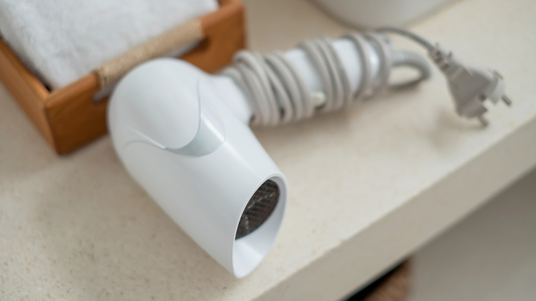 white hairdryer on sink