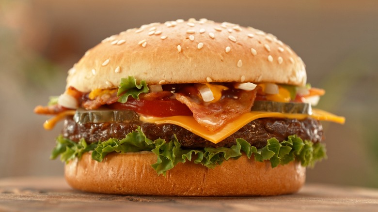 a cheeseburger with toppings