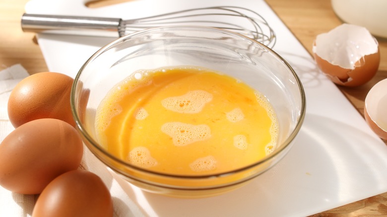 Raw egg in bowl