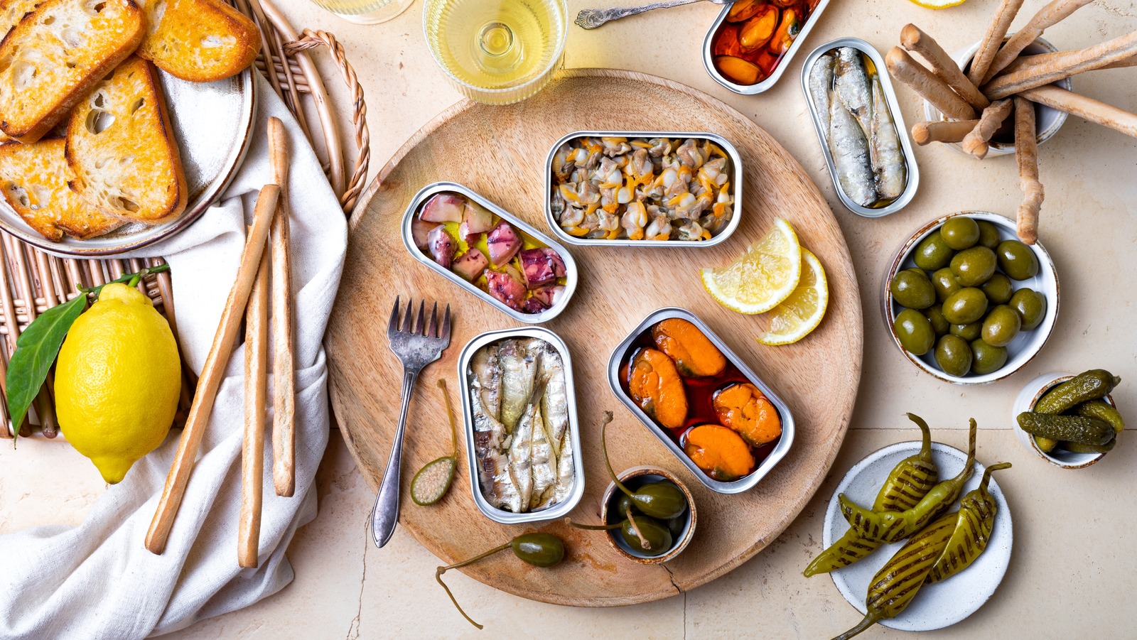 Tinned Fish Is The Key To Deliciously Affordable Charcuterie Boards