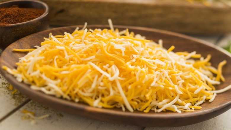 A bowl of shredded cheese.