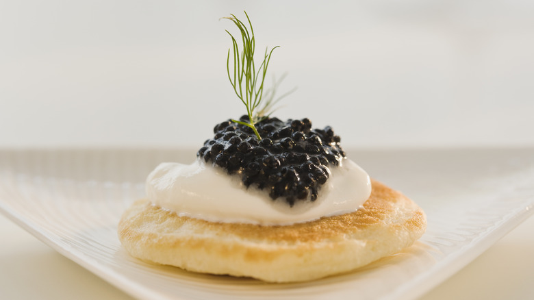 Caviar over cream and bread