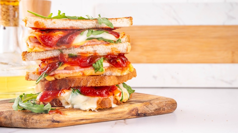 Grilled cheese sandwiches with pizza ingredients