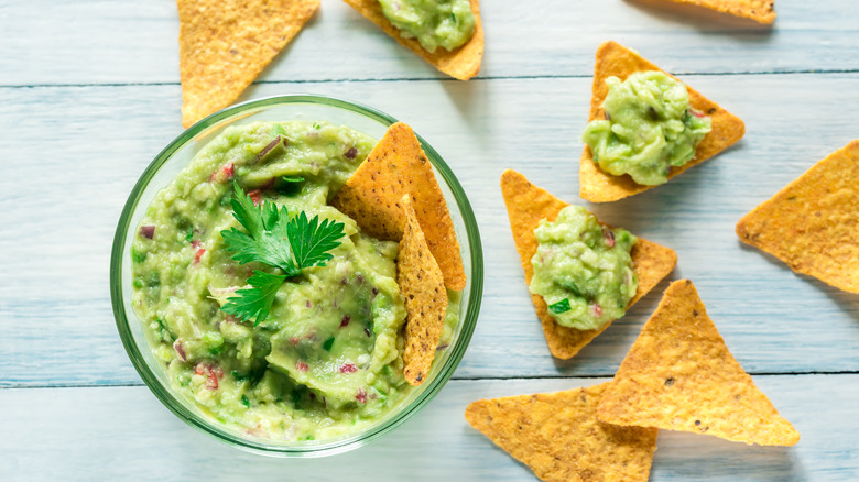Bowl of guacamole with corn chips