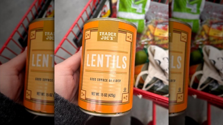 A hand holds a can of Trader Joe's canned Lentils