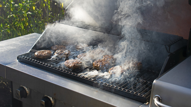 burgers on smoky gas grill