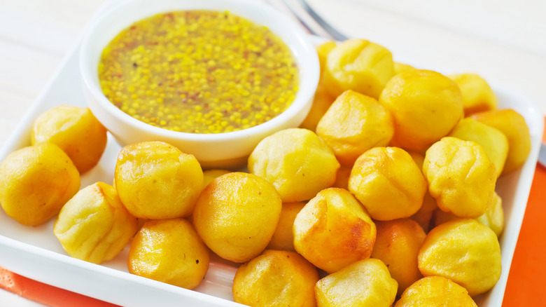 Parisian potato balls with mustard dipping sauce