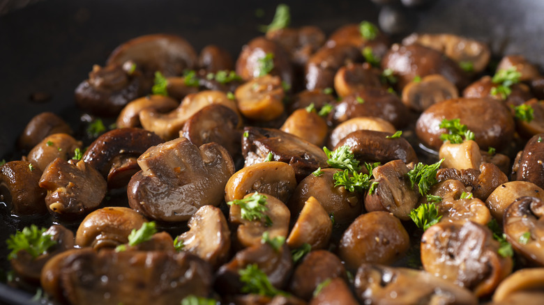 Sautéed mushrooms in pan