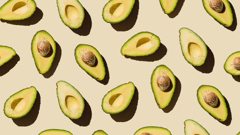 pattern of avocados sliced in half