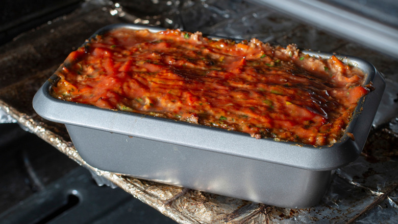 Meatloaf with ketchup on it in oven