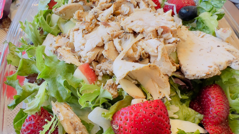 Chick-fil-A salad with berries, apples, chicken, fresh lettuce