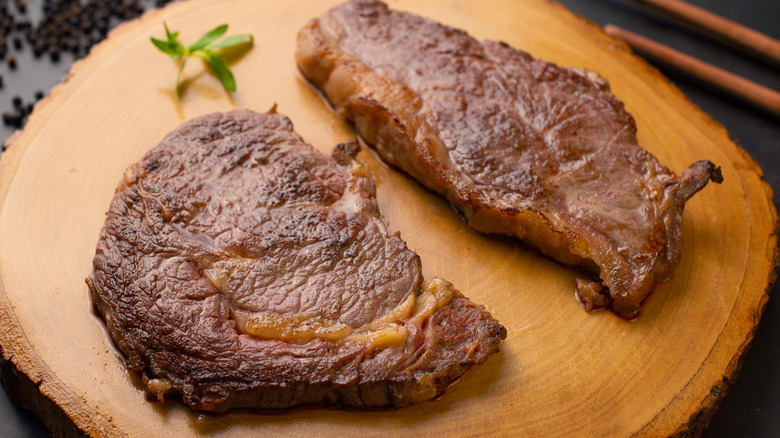 Grilled steak on wooden board