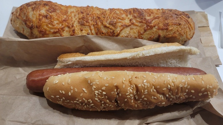 a costco hot dog along with a costco chicken bake