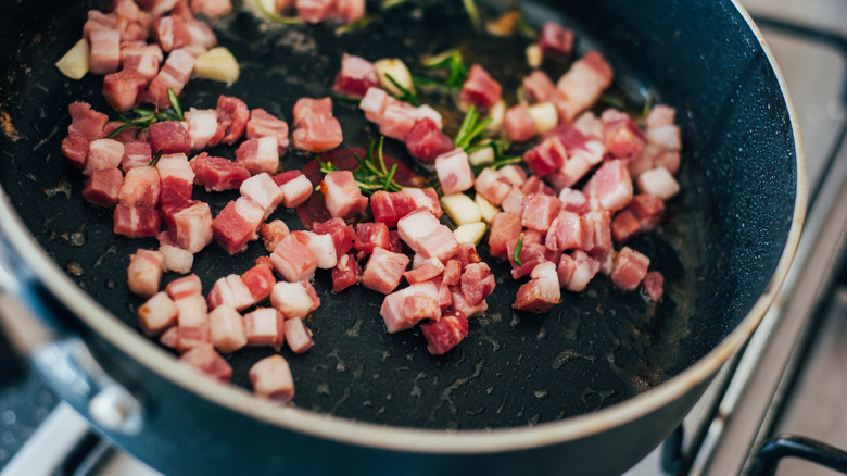 pancetta frying in pan