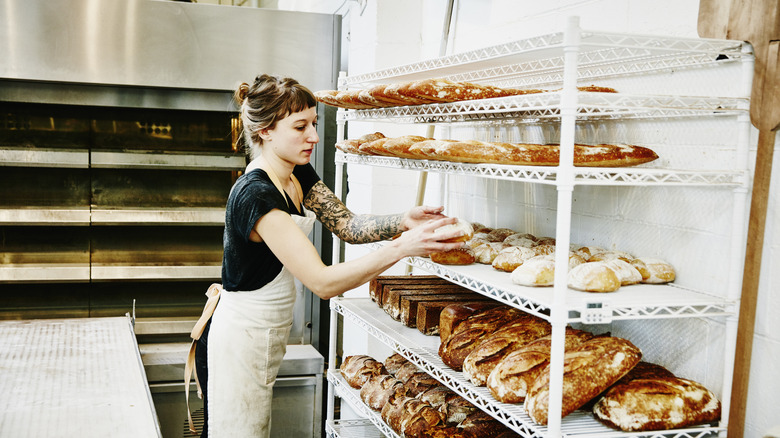 a baker prepares the selection of bread