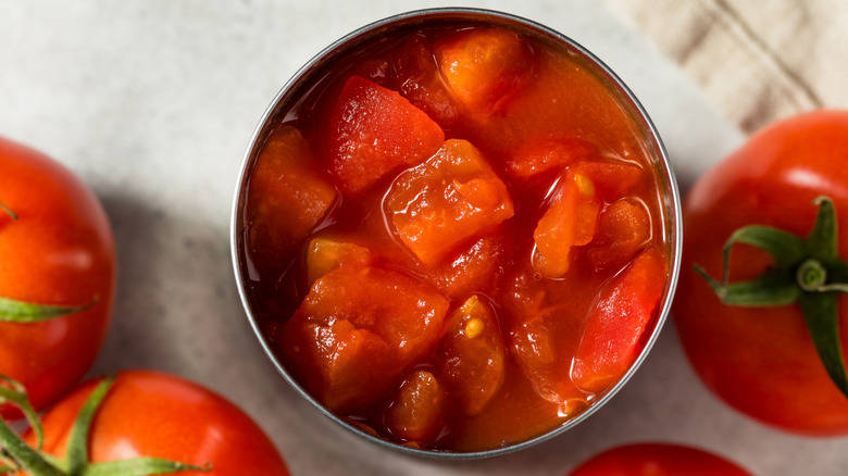 Top-down view of open can of diced tomatoes