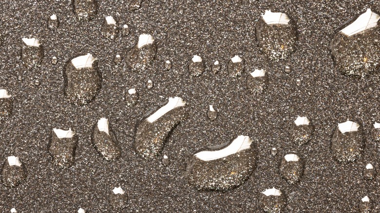 super close up of oil droplets on a nonstick surface