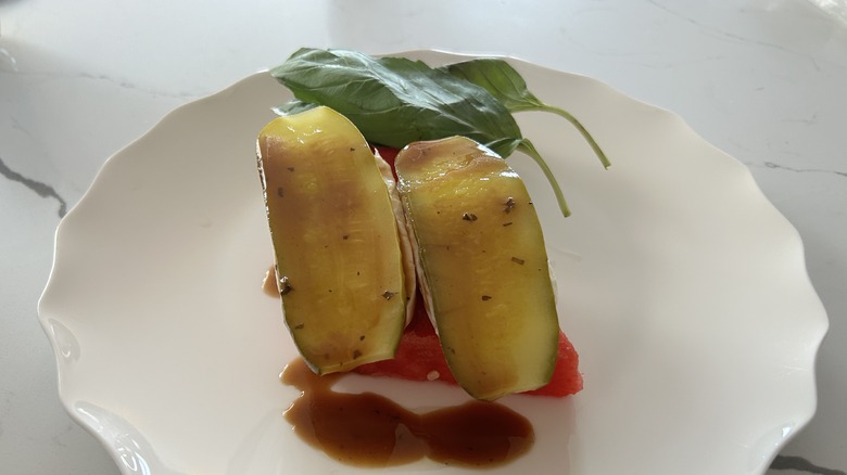 overhead photo of pickle slices on watermelon and mozarella