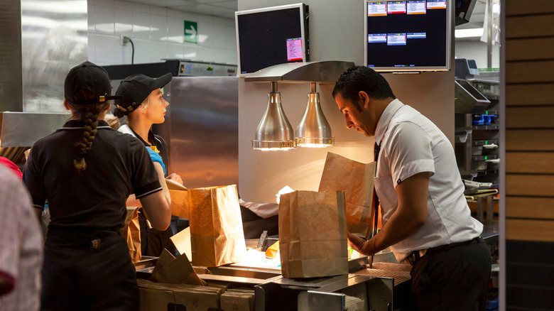 McDonald's employees working in kitchen