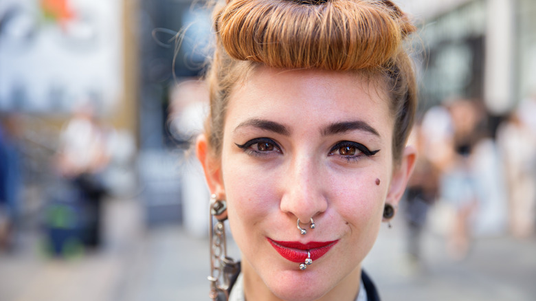 Person with facial piercings