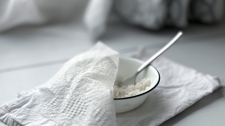 Bowl of white rice with paper towel covering