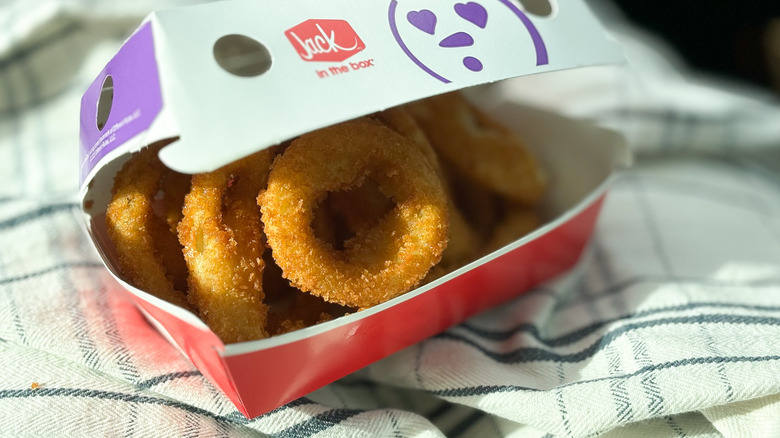 Jack in the Box onion rings in wax paper carton