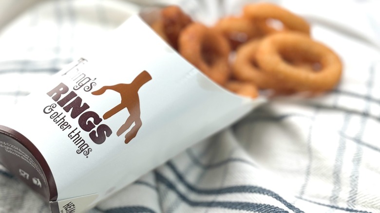 Thing's Rings carton with Burger King onion rings on towels