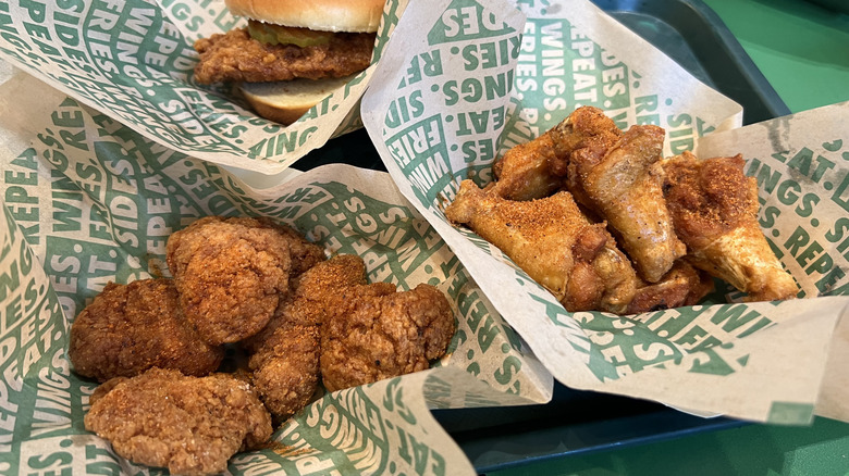 Baskets of Wingstop Hot Honey Rub flavored chicken