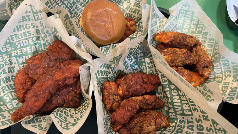 Baskets of Wingstop Cajun flavored chicken