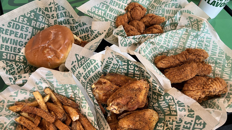 Baskets of Wingstop Louisiana Rub flavored chicken