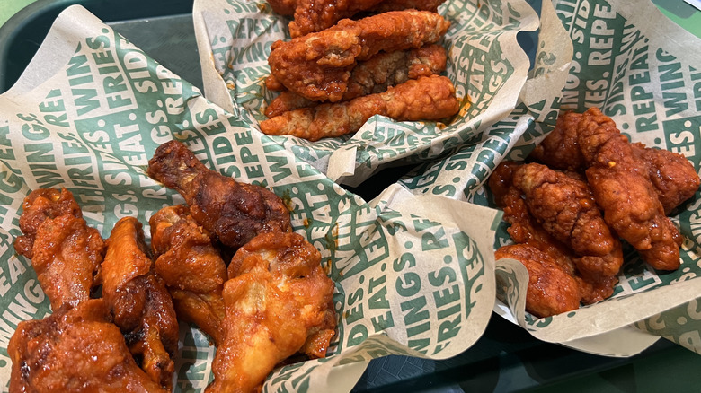 Baskets of Wingstop Original Hot flavored chicken