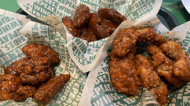 Baskets of Wingstop Atomic flavored chicken