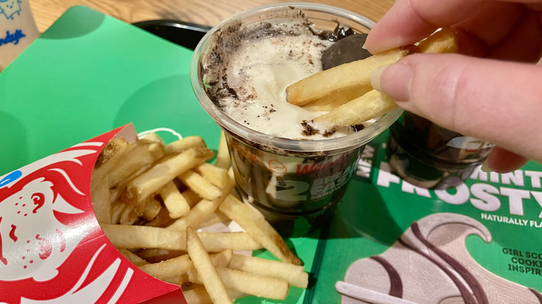 Dipping Wendy's french fries into a chocolate Thin Mints Frosty