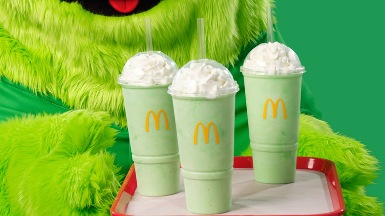 McDonaldland character Uncle O'Grimacey holds a tray of Shamrock Shakes