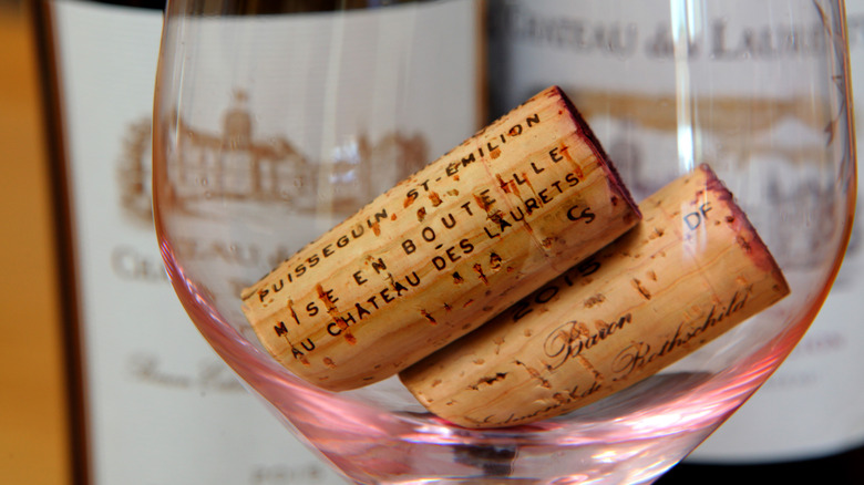 Two wine corks in a wine glass