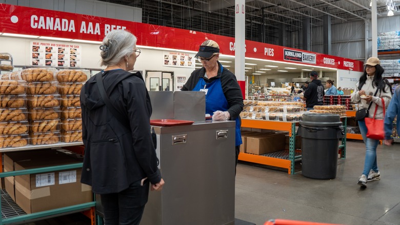 Woman waiting to receive Costco free sample