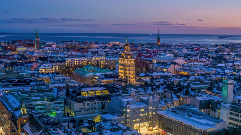 A photo of Helsinki, Finland, in the snow at sunset