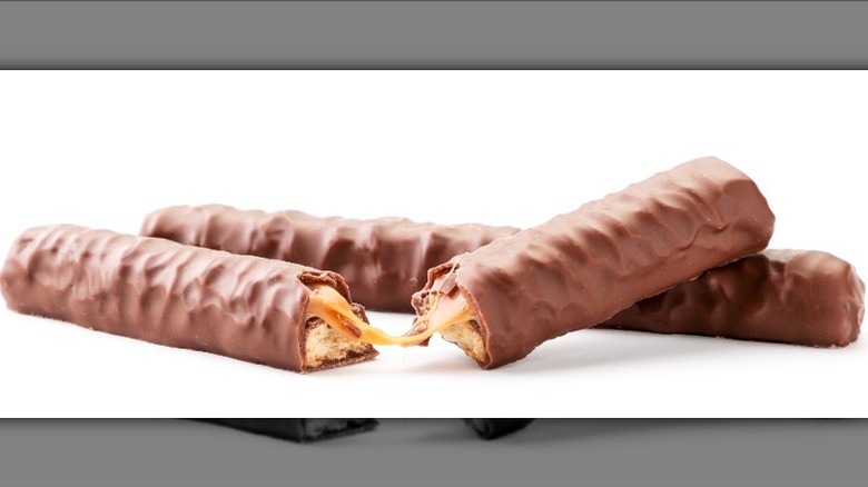 twix chocolate bars with caramel on white background unpackaged