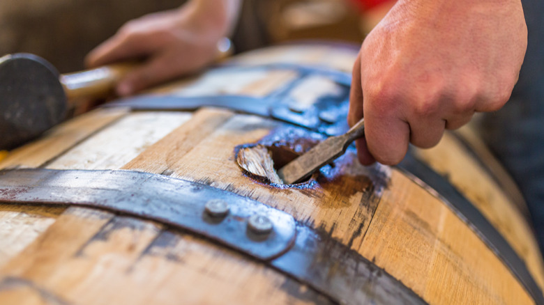 whiskey barrel being opened