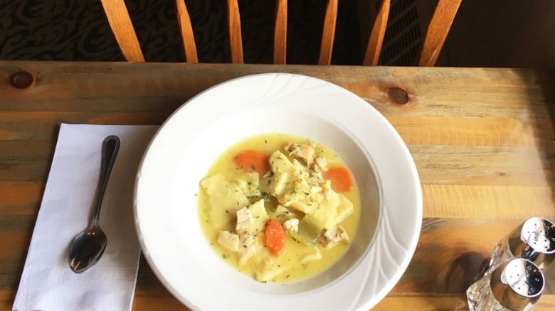 chicken pot pie in  white bowl on a wooden table at Miller's Smorgasbord