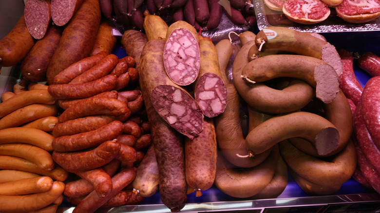 A display case of cured sausages