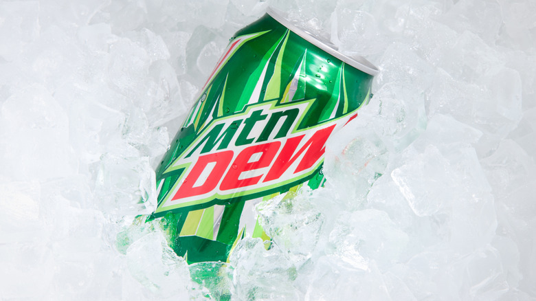 Close up of a can of Mountain Dew in a bed of ice