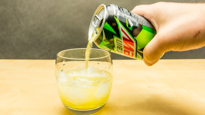 Glass of Mountain Dew with ice sitting on a counter top