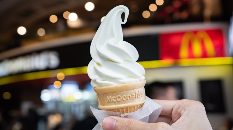 hand holding ice cream cone