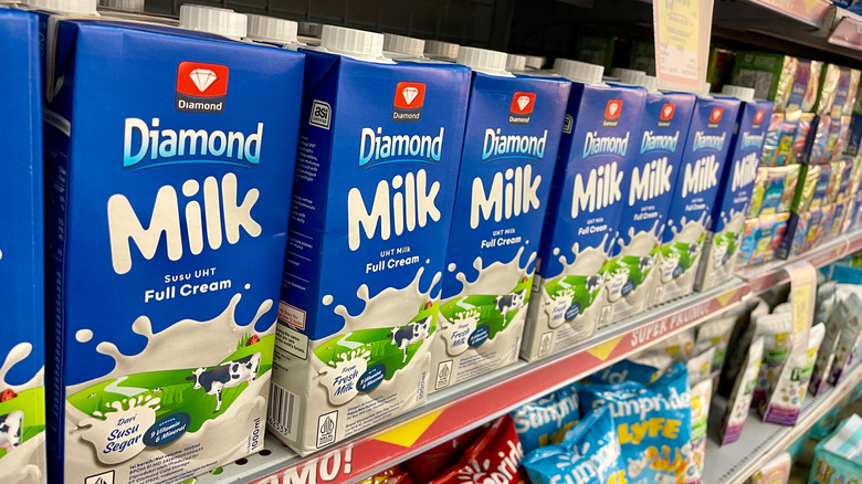 Boxes of shelf-stable milk on a grocery store shelf