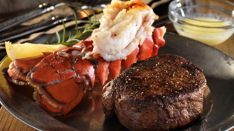 Metal plate with steak and lobster tail