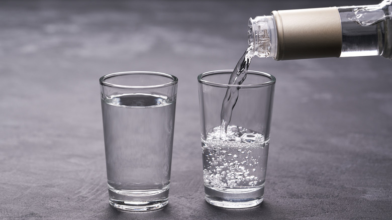 vodka being poured into shot glass